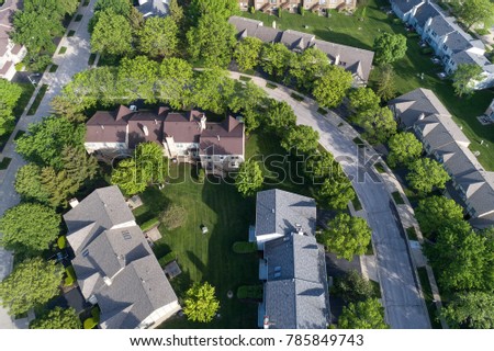 Aerial view of a townhouse complex in a circular Chicago suburban neighborhood in summer. Hoffman Estates, IL. USA