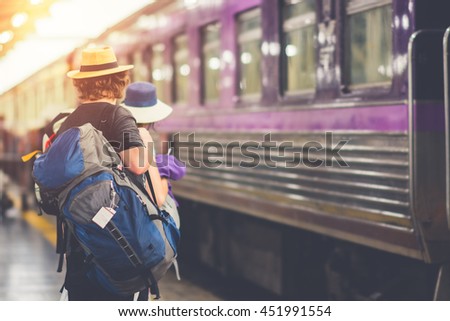 Travelers are waiting for their train. Outdoor adventure travel by train concept. Location: Bangkok, Thailand. Happy/positive/healthy hike/travel/wanderlust concept