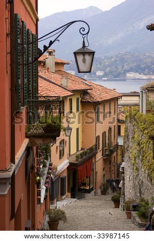 Street in small village on Italy\'s Lake Como with wrought iron streen lamp