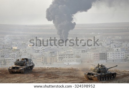 Tanks and soldiers of Turkish military waiting at Turkey - Syria border near source district in Sanliurfa, 27 October 2014, Sanliurfa , Turkey