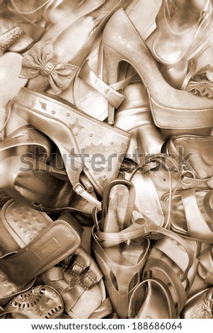 Lots of old gold color shoes. Shoe background.