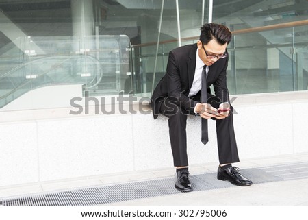 Business man using a variety of mobile devices, mobile phones, smart watches, tablet, computer