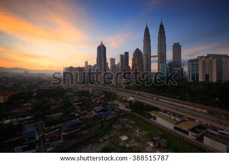 KUALA LUMPUR May 15 2015 : Petronas Twin Towers at sunrise with vibrant sky on 15 May 2016 in Kuala Lumpur. Petronas Twin Towers also known as KLCC is the tallest building in Malaysia.