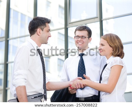 Handshake between office workers outdoor