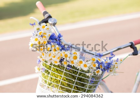 Photo of basket full of wild flowers. For themes like love, valentine\'s day, mother\'s day, holidays, vacations.