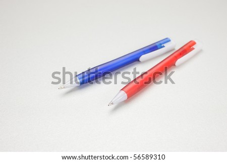 Set of colored pens on grey table