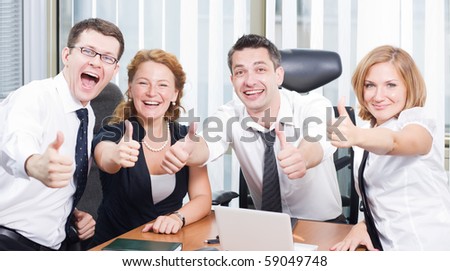 Business team express positivity on meeting in board room