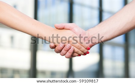 Handshake between office workers outdoor