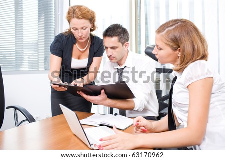 Meeting Room Manager on Manager With Office Workers On Meeting In Board Room Stock Photo