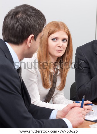 Group of white-collar workers on meeting in board room