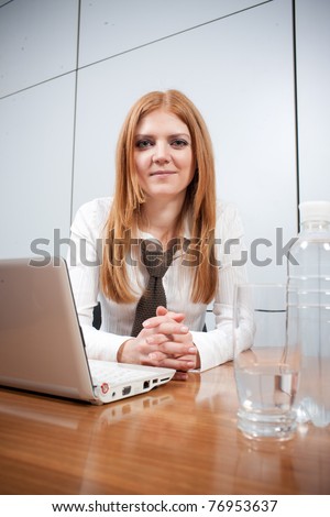 Real office worker posing for camera in board room