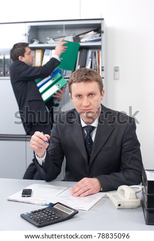 Real office worker posing for camera in Hi Res