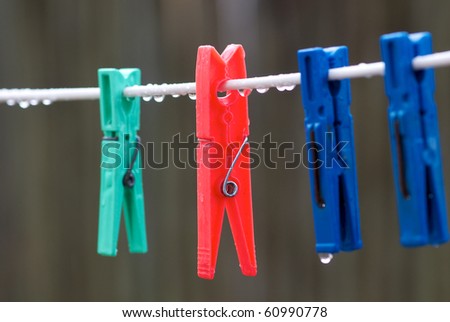 Bright colored washing pegs on line