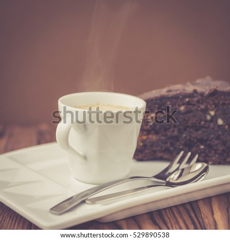 Cup of coffee and slice of chocolate cake Sacher
