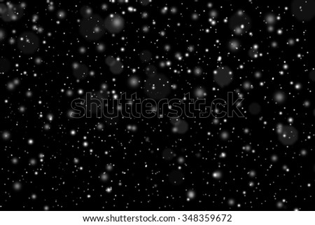 Falling snow on the black background. Snowfall for use as a texture layer in your project. Design element for overlay. Snow layer for design. Christmas concept