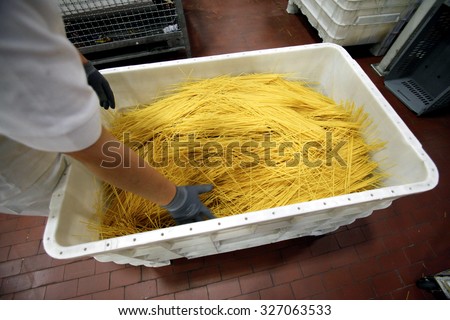 PARMA, ITALY - 3 OCTOBER 2012: Rejected strands of spaghetti are seen inside inside a pasta factory.