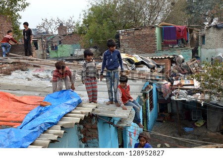 NEW DELHI,INDIA-FEBRUAR Y 4:children not unidentified play on the rooftops of the l slum in New Delhi.50% of the population of New Delhi is thought to live in slums,on February 4,2013 in New Delhi