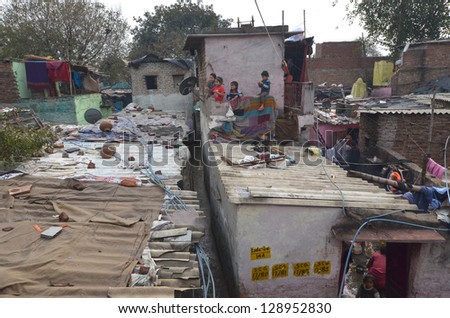 NEW DELHI,INDIA-FEBRUARY 4:children not unidentified play on the rooftops of the l slum in New Delhi.50% of the population of New Delhi is thought to live in slums,on February 4,2013 in New Delhi