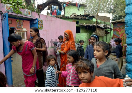 NEW DELHI,INDIA-FEBRUARY 4 : a group of mothers and children living in the slums of New Delhi, on February 4,2013. In India dramatically increases the number of poor