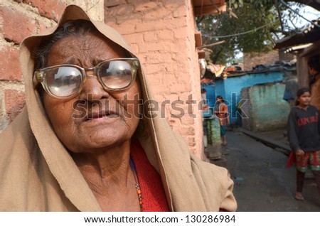NEW DELHI,INDIA-FEBRUARY 4:Portrait of a elderly woman  in the poor slum of New Delhi in February 4,2013.In New Delhi dramatically increases the number of poor people living in slums