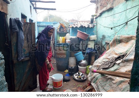 NEW DELHI,INDIA-FEBRUARY 4 :An unidentified woman in the courtyard of his house in New Delhi in February 4,2013. 50% of the population of New Delhi is thought to live in slums
