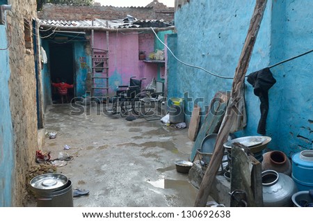 NEW DELHI,INDIA-FEBRUARY 4 : courtyard of a house in the poor neighborhood of New Delhi in February 4,2013. In New Delhi dramatically increases the number of poor people living in slums