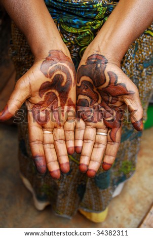 stock photo hands tattooed woman of African