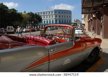 HAVANA - CIRCA FEBRUARY 2009: One of the many old American cars is seen on a city street in Havana, circa February 2009. Owning one of these cars is an asset for Cubans.