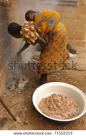 OUAGADOUGOU,BURKINA FASO -  MARCH 4: African women produce shea butter on March 4, 2005 in Ouagadougou, Burkina Faso. Shea Butter is used in Africa for food and is widely used in cosmetics as a moisturizer.