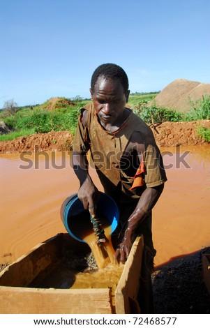 SHINYANGA, TANZANIA-MARCH 18: An unidentified miner looks for gold March 18, 2010in Shinyanga, Tanzania. Tanzania is the third gold producer in Africa after Ghana and South Africa.