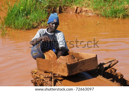 SHINYANGA, TANZANIA - CIRCA MARCH 2010: Gold miner working circa March 2010 in Shinyanga, Tanzania. Tanzania is the third largest gold producer in Africa