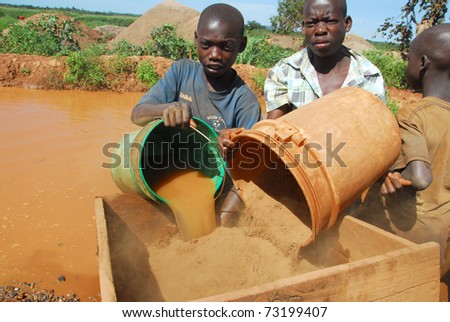 SHINYANGA,TANZANIA - CIRCA MARCH 2010: Child gold miners, Aziz and Abdulay, age 15 circa March 2010 in Shinyanga, Tanzania. Tanzania is the third largest gold producer in Africa