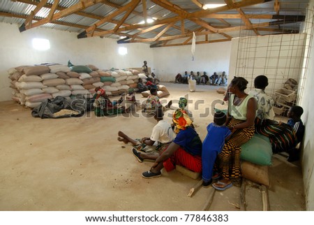 SALIMA,MALAWI – APRIL 25: A couple of farmers stock seeds on  April 25, 2007 in Salima, Malawi. No profit associations  promote seed  storage  to insure survival across the summer  drought period