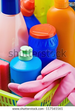 Various cleaning products and pink rubber gloves