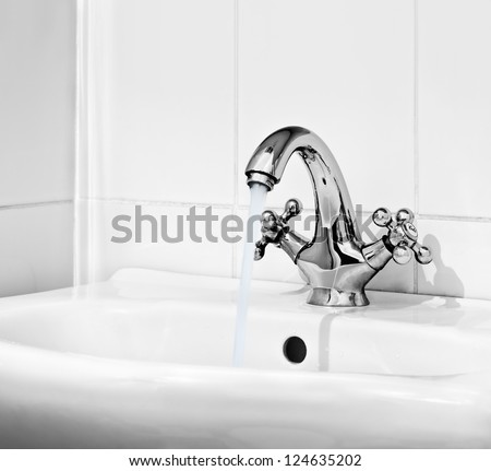Water Pours Out Of The Open Valve