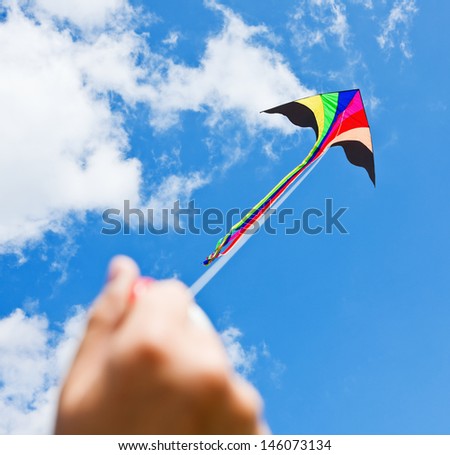 kite flying in a beautiful sky clouds. Focus on the kite.