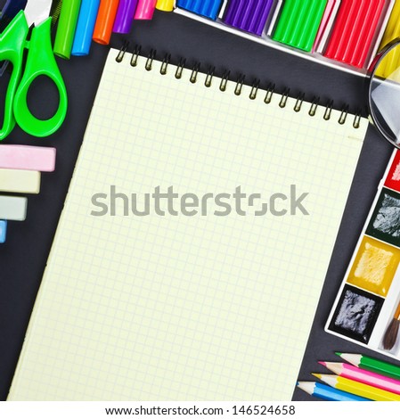 notepad for recording and various school supplies