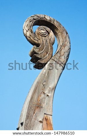 carved bird\'s head on a boat Viking Drakkar in Vyborg. Russia