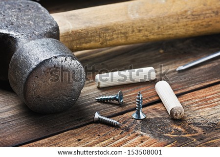 old tools for repairing lie on a wooden table