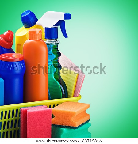 cleaners supplies and cleaning equipment on a green background