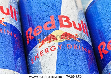 Moscow, Russia - FEBRUARY 27, 2014: Red Bull is an energy drink sold by Austrian company Red Bull GmbH, created in 1987. The most popular energy drink in the world.