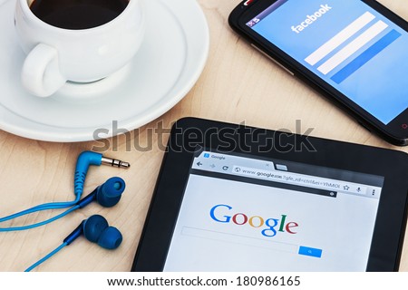 Moscow, Russia - February 27, 2014: Search engine Google and the entrance to the Facebook social network. Google and Facebook are the most advanced Internet companies in the world.