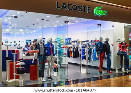 RUSSIA, MOSCOW - MARCH 10, 2014: Lacoste shop windows in a shopping center, Moscow. Is a French clothing company founded in 1933 that sells high-end clothing and most famously polo shirts.