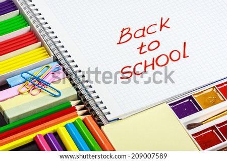 school stationery laid out on the notepad with the words back to school