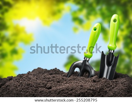 tools garden soil on nature background. Focus on tools