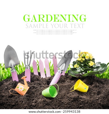 garden tools in soil isolated on white background. The text is an example and can be easily removed