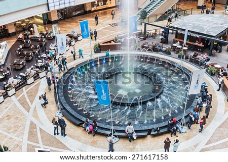 Moscow, Russia - April 19, 2015: shopping in Afimall City in Moscow. Shopping complex Afimall City is located in Moscow City. Area of Afimall-320,000 square metres.Focus on the fountain