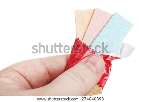 chewing gum in hand isolated on white background. focus on chewing gum