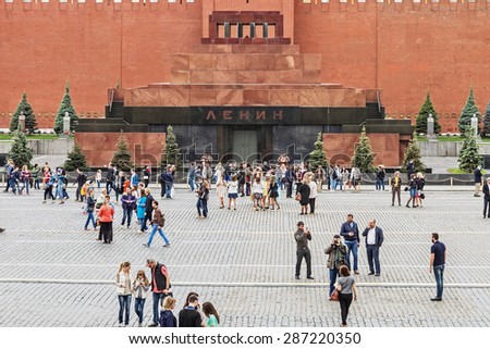Moscow, Russia - May 23, 2015: Lenin's mausoleum on Red Square, landmark, tourists strolling on the square. the main square of Moscow, located in the center of city planning in the Moscow Kremlin