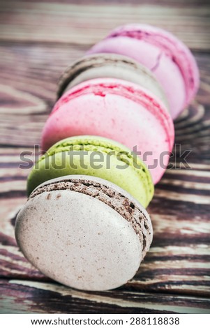 macaroon on a wooden table. focus on the foreground macaroon